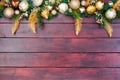 Pretty Christmas border wreath atop wood Royalty Free Stock Photo