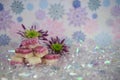 Pretty Christmas food photography picture of English old fashioned coconut ice sweets with winter flowers and snowflake patterns