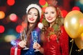 Pretty Christmas women on abstract bokeh glitter sparkle party background Royalty Free Stock Photo