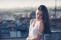 Pretty city girl portrait enjoy in sunset at rooftop