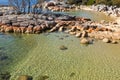 Pretty Coastal scene with turquoise waters rippled, rocky coastline at Skeleton Bay, part of Bay of Fires in Tasmania, Australia. Royalty Free Stock Photo