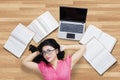 Pretty college student relaxing on the floor Royalty Free Stock Photo