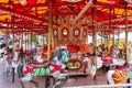 Carnival merry go round with pretty colorful horses