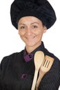 Pretty cook girl with wooden cookware Royalty Free Stock Photo