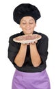 Pretty cook woman smelling ham pizza Royalty Free Stock Photo