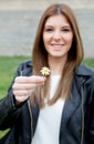Pretty cool girl offering a beautiful flower Royalty Free Stock Photo