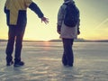 Pretty couple have fun on beach. Winter walk at frozen sea Royalty Free Stock Photo