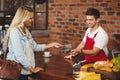 Pretty customer making a mobile payment