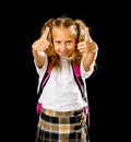 Pretty cute blonde hair girl with a pink schoolbag looking at camera showing thumb up gesture happy to go to school isolated on Royalty Free Stock Photo