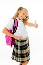 Pretty cute blonde hair girl with a pink schoolbag looking at camera showing thumb up gesture happy to go to school isolated on Royalty Free Stock Photo