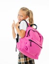 Pretty cute blonde hair girl with a pink schoolbag looking at camera showing thumb up gesture happy to go to school isolated on Royalty Free Stock Photo