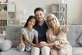 Pretty cute preteen girl kid, dad and grandma sitting together Royalty Free Stock Photo