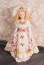 Antique doll in beautiful clothes