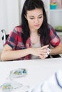 Pretty disabled brunette girl playing cards Royalty Free Stock Photo