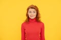 pretty dreamy redhead woman face portrait bite her lip on yellow background, emotions Royalty Free Stock Photo