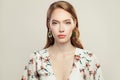 Pretty elegant woman fashion model wearing golden chain earrings on white background Royalty Free Stock Photo