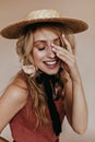 Pretty european girl posing in canotier. Studio shot of blonde young woman in straw hat.. Royalty Free Stock Photo