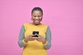 pretty excited young black lady feeling excited while viewing content on her smartphone