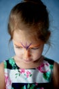 Pretty exciting blue-eyed girl of 2 years with a face painting Royalty Free Stock Photo