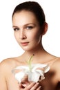 Pretty face of beautiful young woman with lily on hands - white Royalty Free Stock Photo