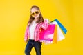 Colorful casual child girl isolated on yellow background Royalty Free Stock Photo