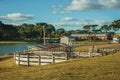 Pretty farm with fences, livestock sheds and lake