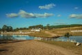 Pretty farm with fences, livestock sheds and lake