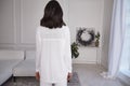 Pretty fashion beautiful woman sexy lady brunette curly hair dark tanned skin wear trend clothes white knitted suit jacket top