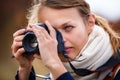 Pretty female amateur photographer taking photos Royalty Free Stock Photo