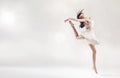 Pretty female ballet dancer in jump figure Royalty Free Stock Photo