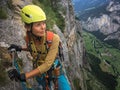 Pretty, female climber on a via ferrata Royalty Free Stock Photo