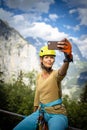 Pretty, female climber on a via ferrata Royalty Free Stock Photo