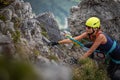 Pretty, female climber on a via ferrata