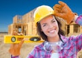 Pretty Female Construction Worker Holding Level Wearing Gloves, Hard Ha Royalty Free Stock Photo