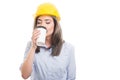 Pretty female constructor drinking takeaway coffee