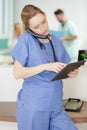 pretty female doctor using mobile phone Royalty Free Stock Photo