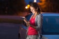 Pretty, female driver using her tablet computer