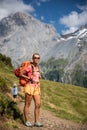 Pretty, female hiker/climber in a lovely alpine setting