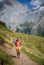 Pretty, female hiker/climber in a lovely alpine setting