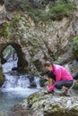 Pretty female hiker tying boot laces Royalty Free Stock Photo