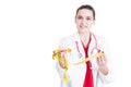 Pretty female medic with tape meter Royalty Free Stock Photo