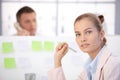 Pretty female office worker sitting at desk Royalty Free Stock Photo