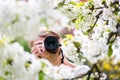 Pretty female photographer outdoors on a lovely spring day Royalty Free Stock Photo