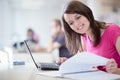 Pretty female student with laptop