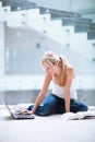 Pretty female student with laptop and books Royalty Free Stock Photo