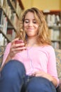 Pretty Female Student Listens to Music Royalty Free Stock Photo