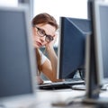 Pretty, female student looking at a desktop computer screen Royalty Free Stock Photo