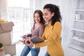 Pretty female students creating list of boxes Royalty Free Stock Photo