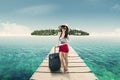 Pretty female tourist standing on jetty Royalty Free Stock Photo