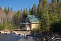 Pretty fishing chalet on the edge of a wild lake in the Canadian forest